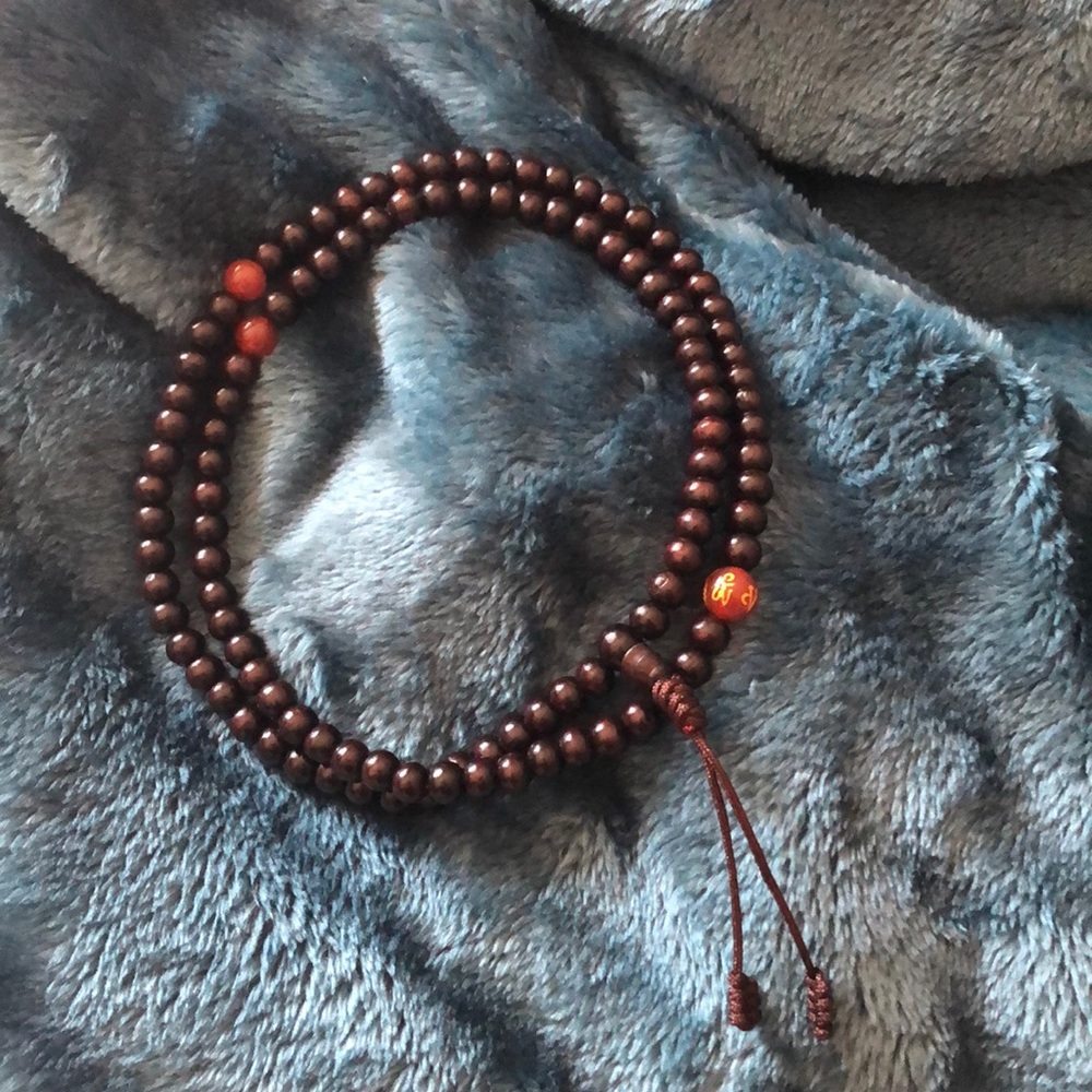 Dark wooden bead mala with accent beads